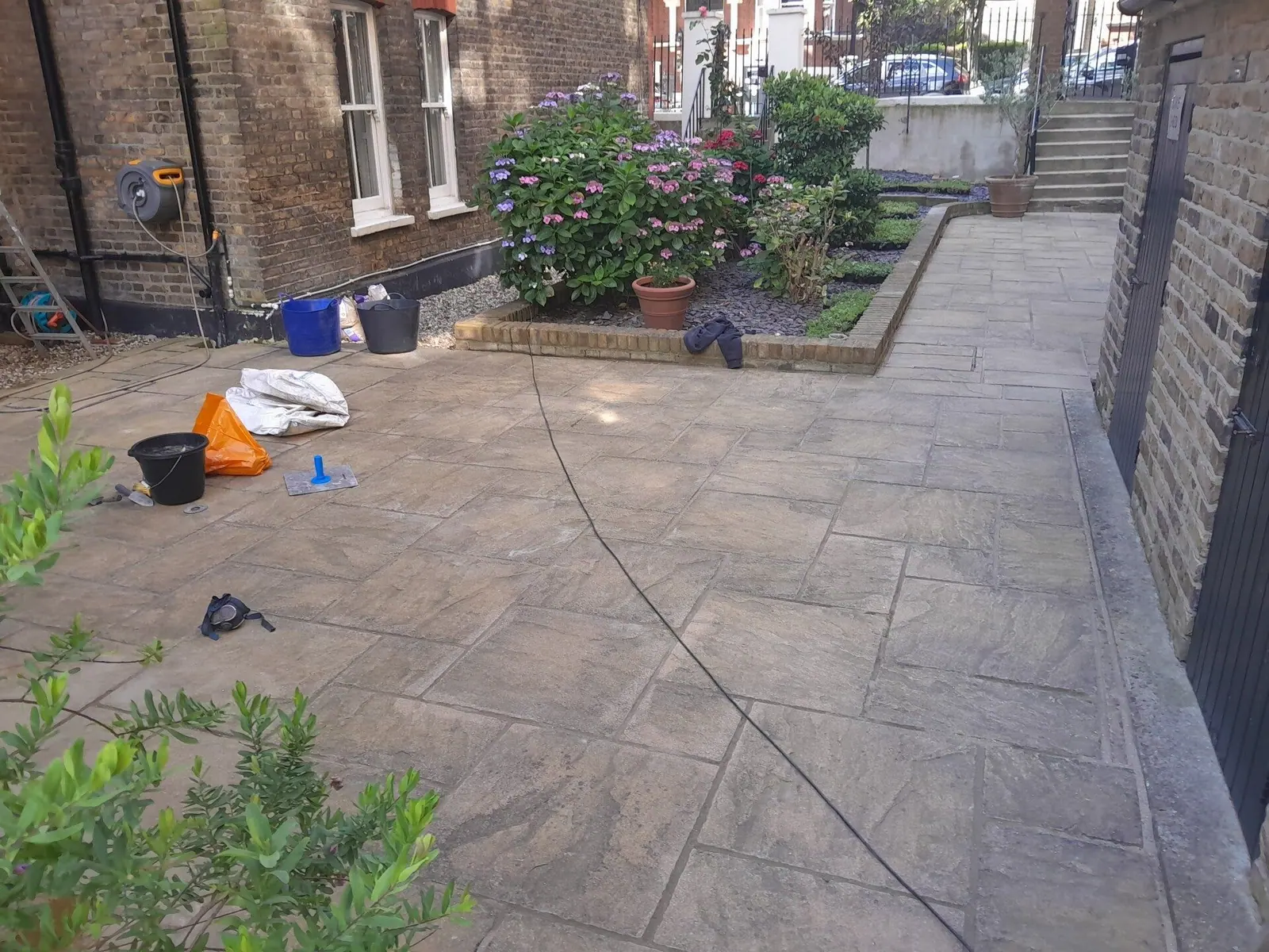 Front driveway paving pressure washed clean